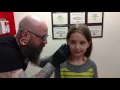 Seven year old gets her ears pierced needle method