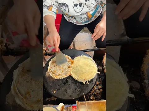 Watching people make vegetable pancakes on the street must make them look delicious