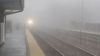A Metra UP-N express cuts through the fog