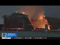 Inferno continues to burn at iconic WWII blimp hangar in Tustin