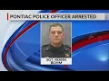 Pontiac police officer arrested charges unclear