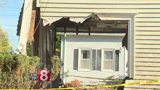 Arrest made after car hits three homes in Thomaston