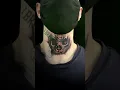 Skull neck tattoo