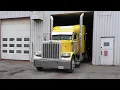 The Yellow Classic Peterbilt 379 - Tall double exhaust stacks backing into garage