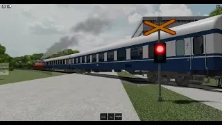Express Train with Dr13 Vahamaa-Honkala crosses Railroad Crossing