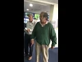Asian man gets angry at a betting shop