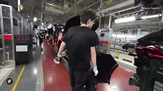 First-person view of the front and rear bumper assembly station in the automobile factory