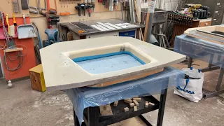 Forward bulkhead rounding of opening edges and carbon reenforcing for ratchet strap