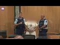 Brenton Harrison Tarrant flashes white supremacist symbol in court