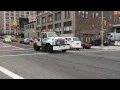 RARE MEDIUM SIZED NYPD TOW TRUCK CRUISING BY ON W 34TH ST IN MIDTOWN MANHATTAN IN NEW YORK CITY