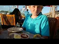 12 Year Old Boy Trying Oysters at Lighthouse Oyster Bar Grille in Oceanside