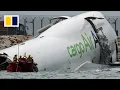 2 dead after Emirates plane slides off Hong Kong runway
