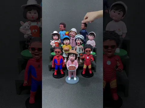 A group of handmade clay kids full of smiles.
