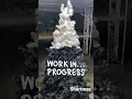 Spray painting Christmas Tree Black and a hint of white was left 7 cans of Spray paint