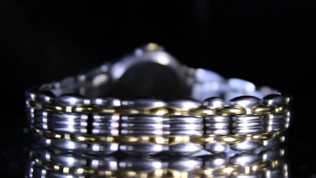 STAINLESS STEEL MOVADO WATCH! BEAUTIFUL GOLD & SILVER LOOK! UNIQUE STYLE! NR!