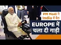 PM Modi driving a car in Europe while seated in India through 5G network. Check out the video.