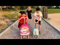 Download Lagu Children play on scooters in the park