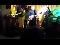 Jonny Greenwood playing the harmonica and dancing funny