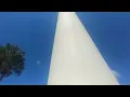 huge American flag flying in high winds at uptown station in Fort Walton Beach FL