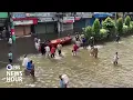 As rising sea levels swallow Bangladesh's land, its climate refugees are forced to adapt