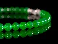 An Extraordinary Imperial Green Jadeite Bead and Diamond Necklace
