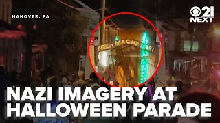 Halloween parade float replicates Auschwitz gate 21 Next