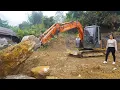 Excavator leveling the ground for building a new house - Girl leading excavator working
