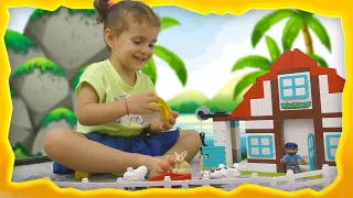 Sara pretends to play with a new toy from LEGO Duplo Farm Adventure