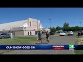 Gun show continues despite warnings on large gatherings