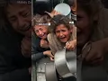 Lagu Children risk being crushed whlie lining up at charity kitchen in Gaza