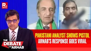 watch pakistani analyst shows pistol on live tv arnab s response goes viral the debate