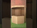 Building a pretend play toy shop out of cardboard and Makedo