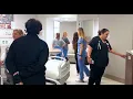Team members move through mockup of new hospital space