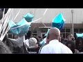 Families and friends honor three men murdered last week