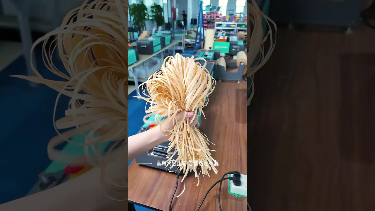 Desktop cutting machine slices kraft paper and cardboard into neat uniform strips