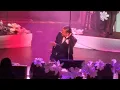 WOMAN BRINGS MAXWELL TO HIS KNEES DURING CONCERT