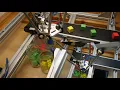 Sorting moving parts on a conveyor with an industrial delta robot