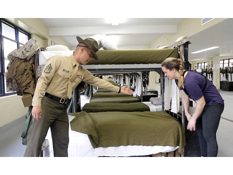 U.S. Marine tries to teach reporter how to make a military-style bed