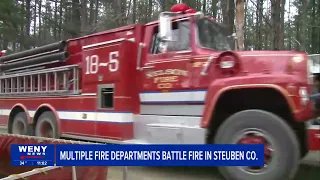 Multiple fire departments battle building fire in Steuben County