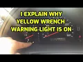 I EXPLAIN WHAT CAUSE THE YELLOW WRENCH WARNING LIGHT TO TURN ON
