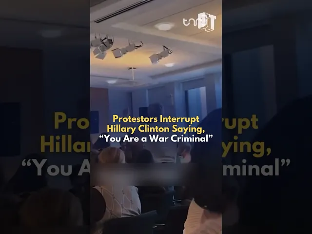 ⁣Hillary Clinton faces interruptions from a protester as she speaks on a panel at Columbia University