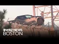 Pickup truck hangs off edge of Boston bridge after crash