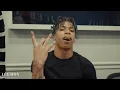 NLE Choppa throwing up gang signs while buying grills