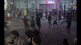 woman stumbles and tumbles on Bourbon Street