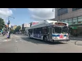 Q25 and Q34 buses flying down Main St