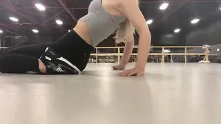 Dove Cameron stretching