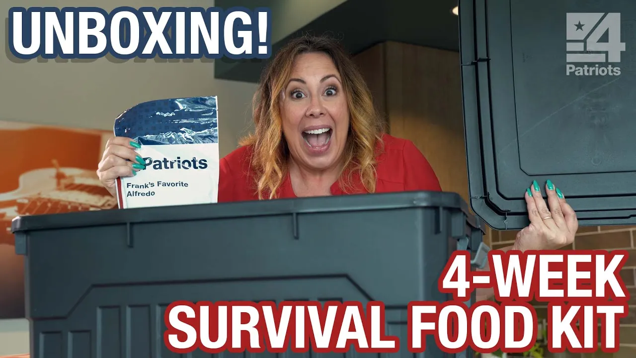 A woman with long, wavy hair and a big excited smile opens a large black plastic container labeled "4Patriots." She's holding up a food pouch labeled "Frank's Favorite Alfredo." The scene is indoors with the word “UNBOXING!” in bold letters at the top and “4-WEEK SURVIVAL FOOD KIT” at the bottom, suggesting an enthusiastic reveal of emergency food supplies.
