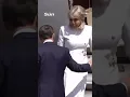 Moment Brigitte Macron rejects husband s help leaving plane after viral slap vid