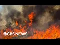 Wildfires rage in Canada and western U S