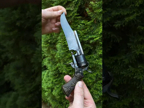 Antique pinfire revolver with damascus steel blade